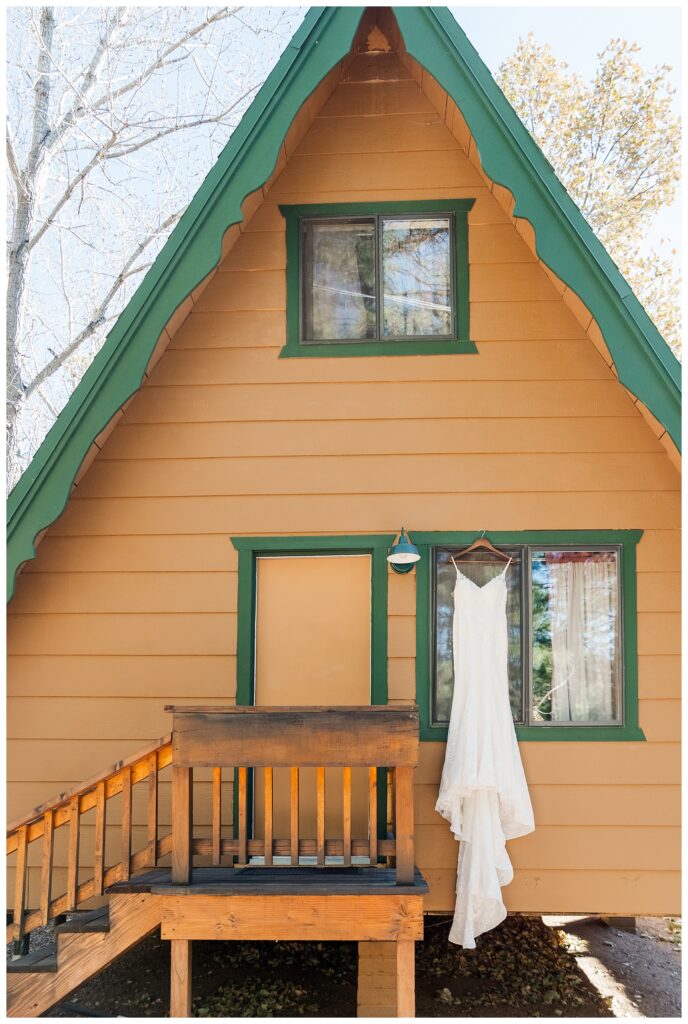 Wedding dress hanging on outside of cabin at Cabins on Strawberry Hill