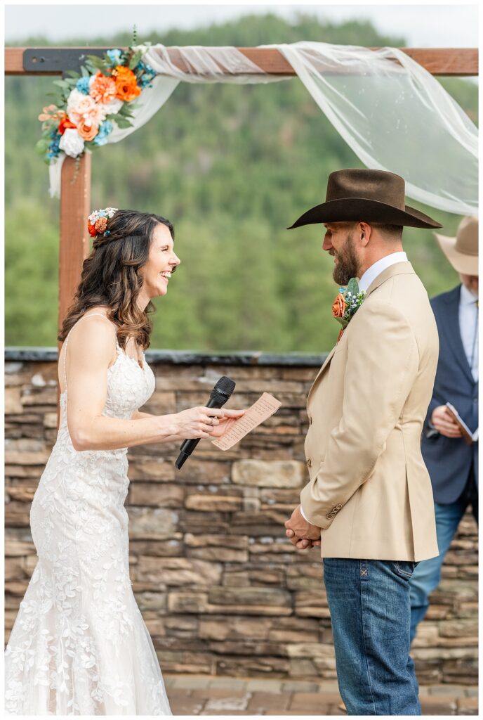 Bride laughing during exchange of vows