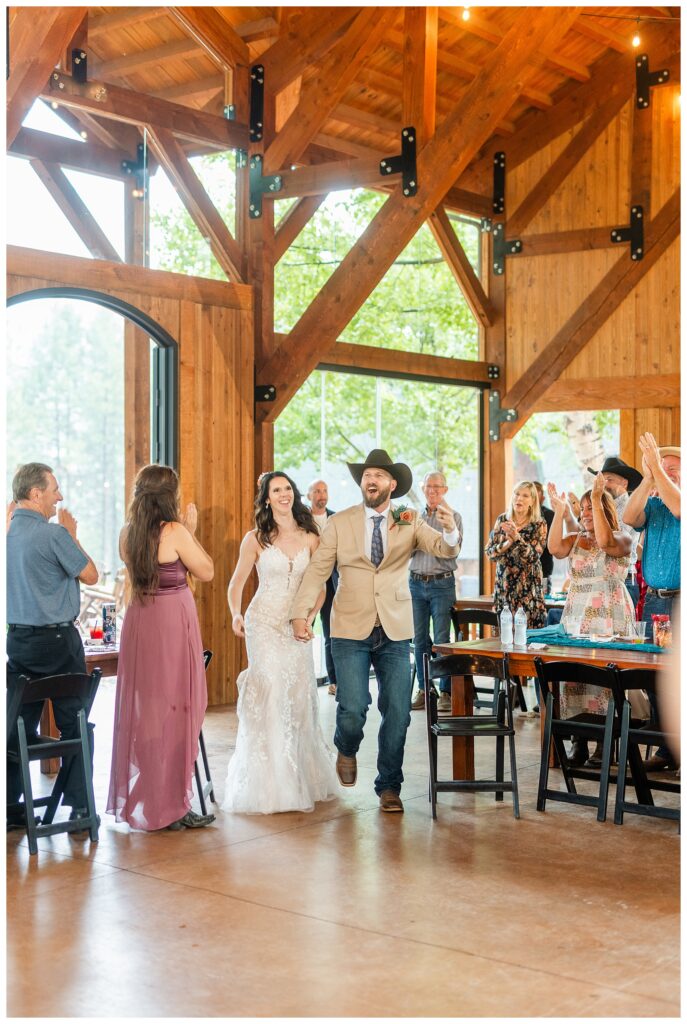 Bride and Groom grand entrance into the reception ramada at Cabins on Strawberry Hill