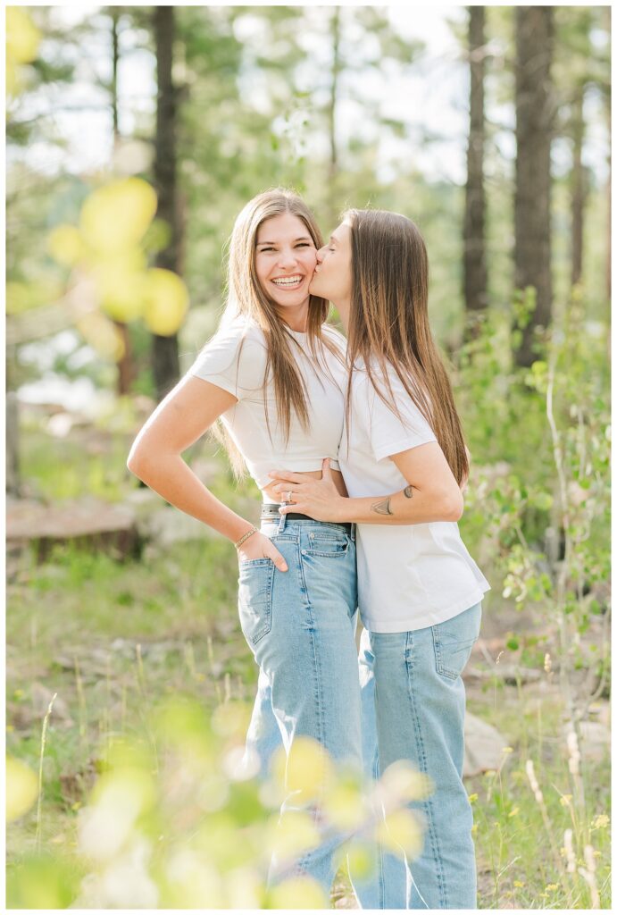 Couple standing in forest at Willow Springs Lake for their engagement photos